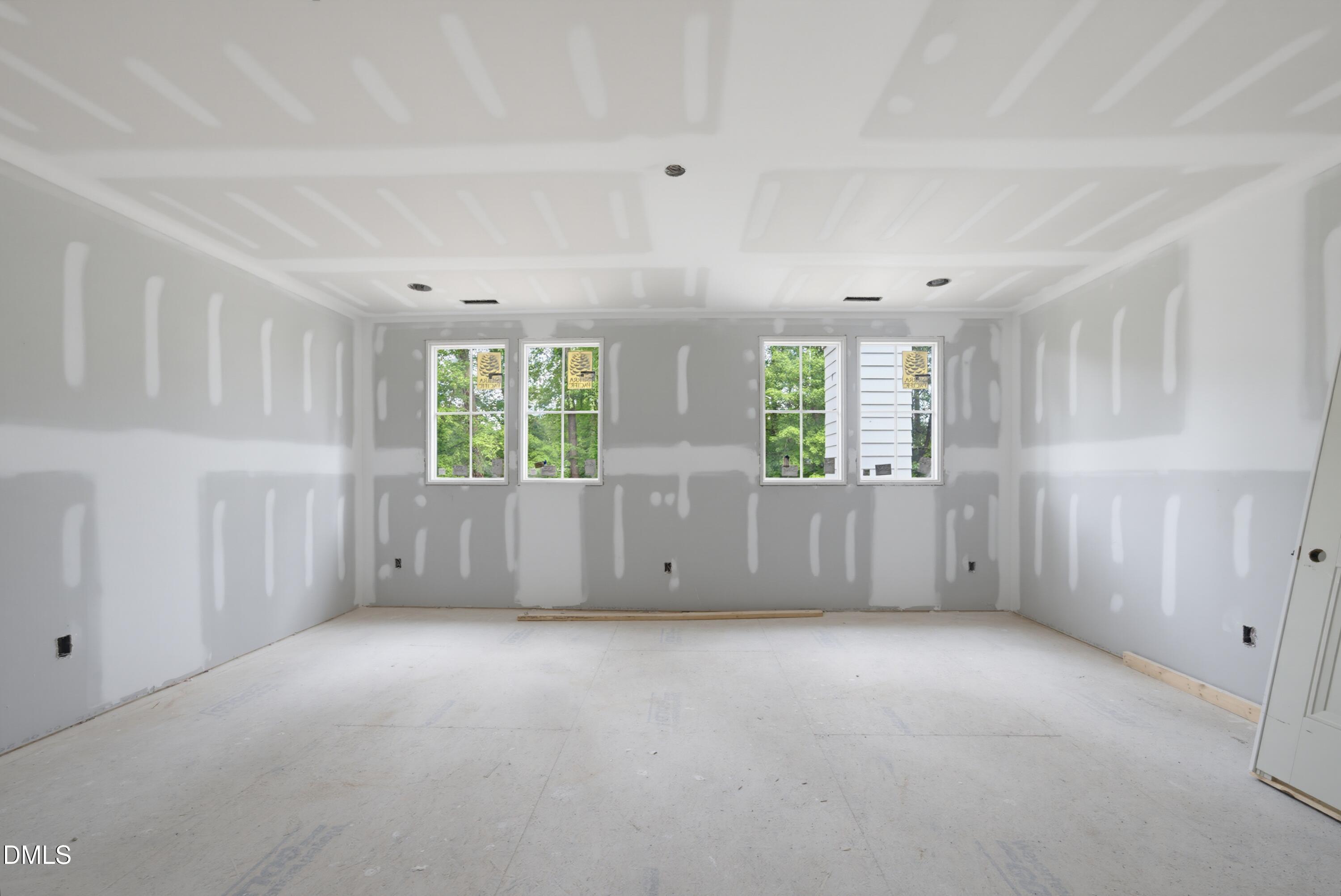 7508 Grist Mill Road Raleigh, NC 27615 - Photo 16 of 32 a view of an empty room with windows