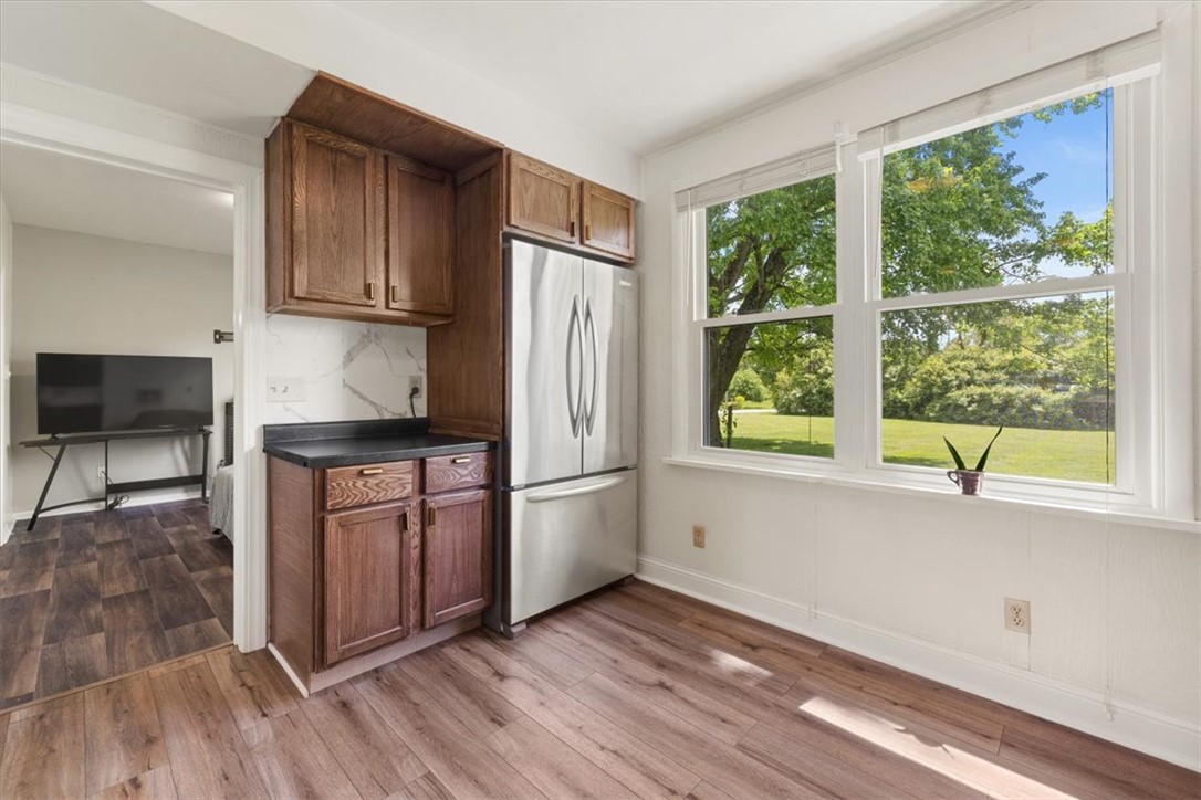 5120 Wheelock Road Troy, OH 45373 - Photo 20 of 67 This bright kitchen features a large window offering expansive outdoor views.
