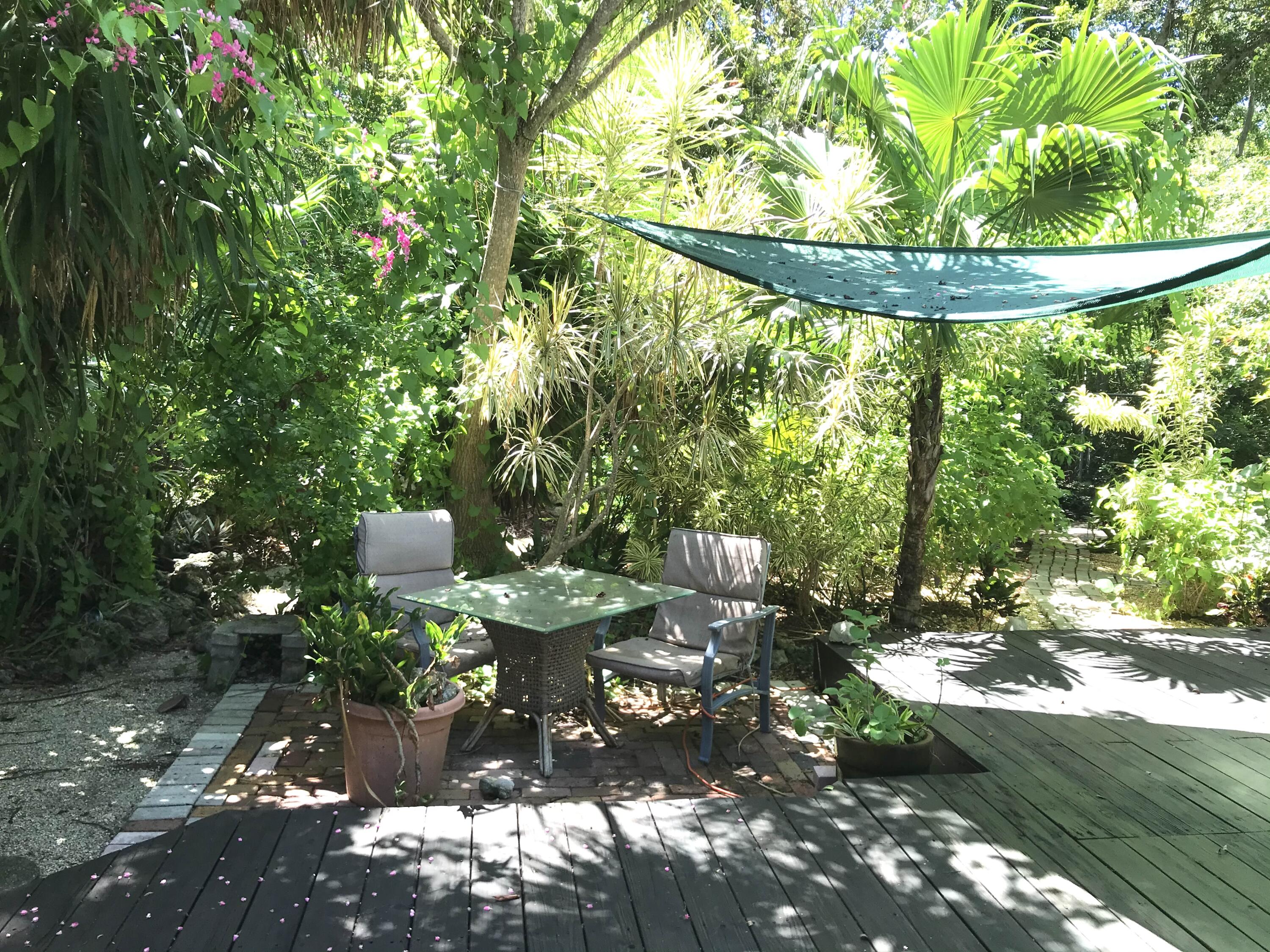 809 Largo Road Key Largo, FL 33037 - Photo 22 of 29 Sunshade and seating area