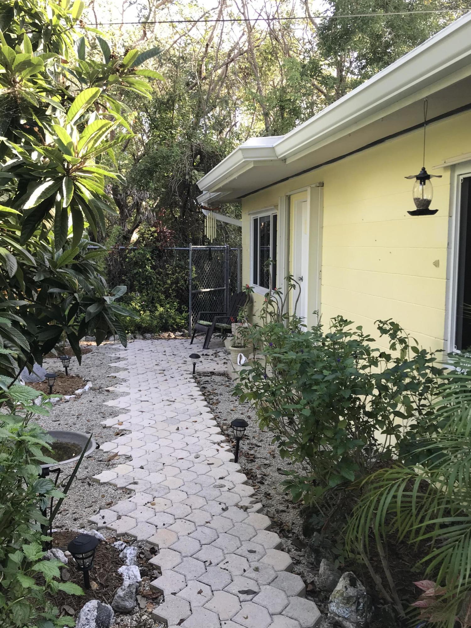809 Largo Road Key Largo, FL 33037 - Photo 26 of 29 Gutters run the length of the house