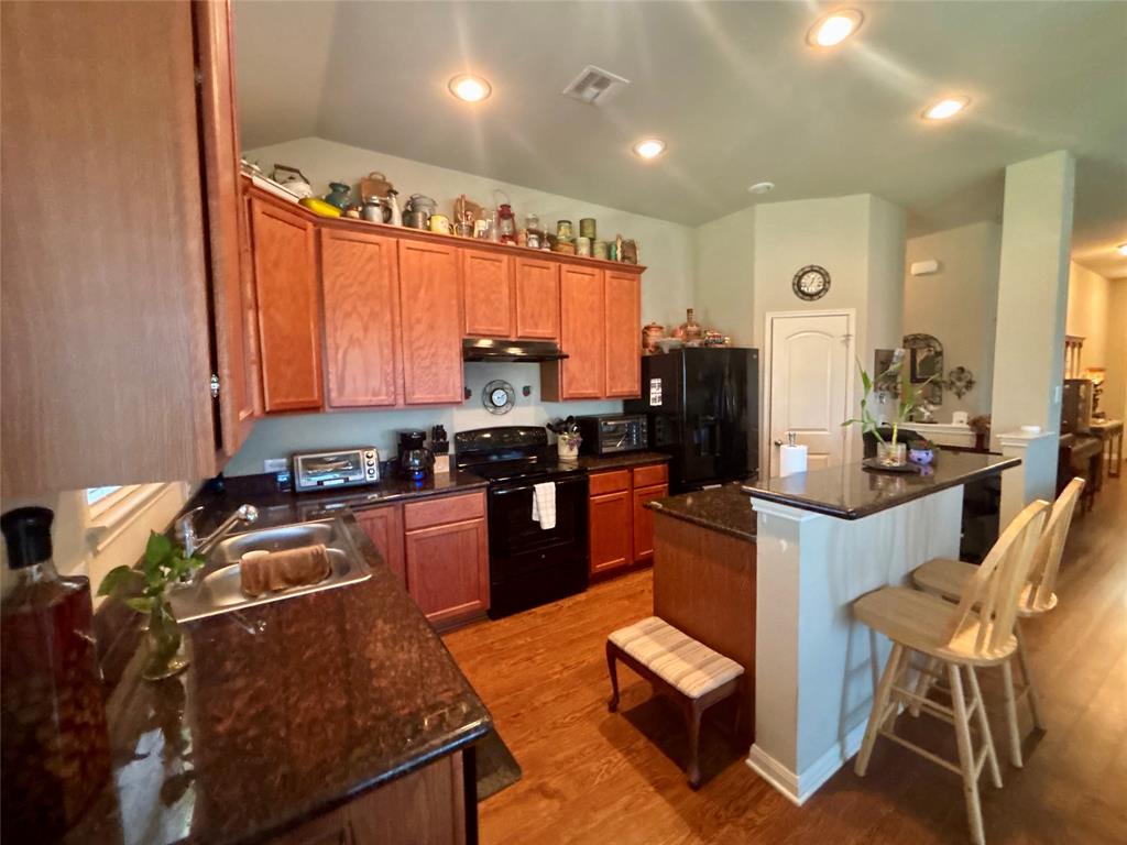 10717 Fallbrook Road Waco, TX 76708 - Photo 12 of 33 a kitchen with granite countertop lots of counter top space