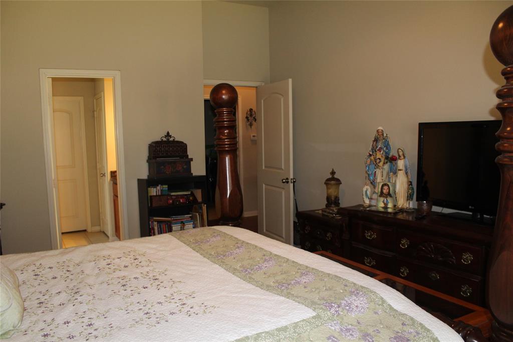 10717 Fallbrook Road Waco, TX 76708 - Photo 17 of 33 a bedroom with a bed and a flat screen tv
