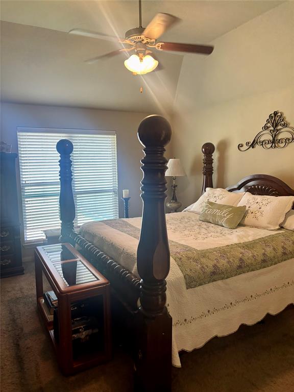 10717 Fallbrook Road Waco, TX 76708 - Photo 19 of 33 a room with a bed and a chandelier