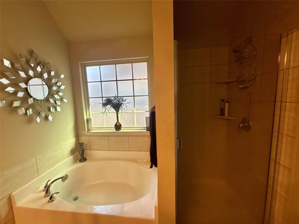 10717 Fallbrook Road Waco, TX 76708 - Photo 23 of 33 a bathroom with a bathtub