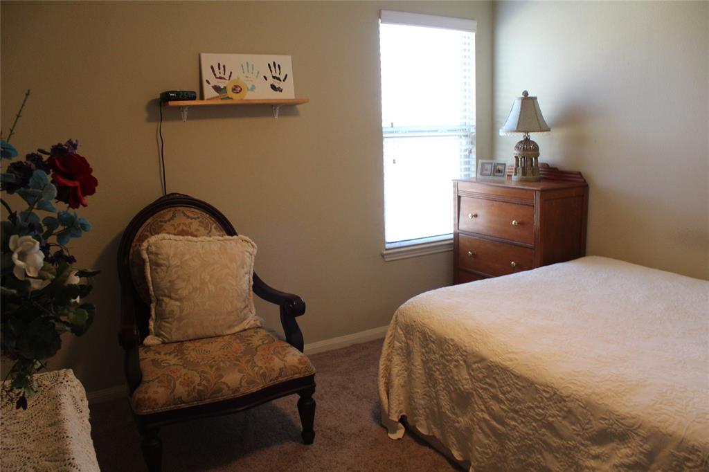 10717 Fallbrook Road Waco, TX 76708 - Photo 25 of 33 a bedroom with a bed and a window