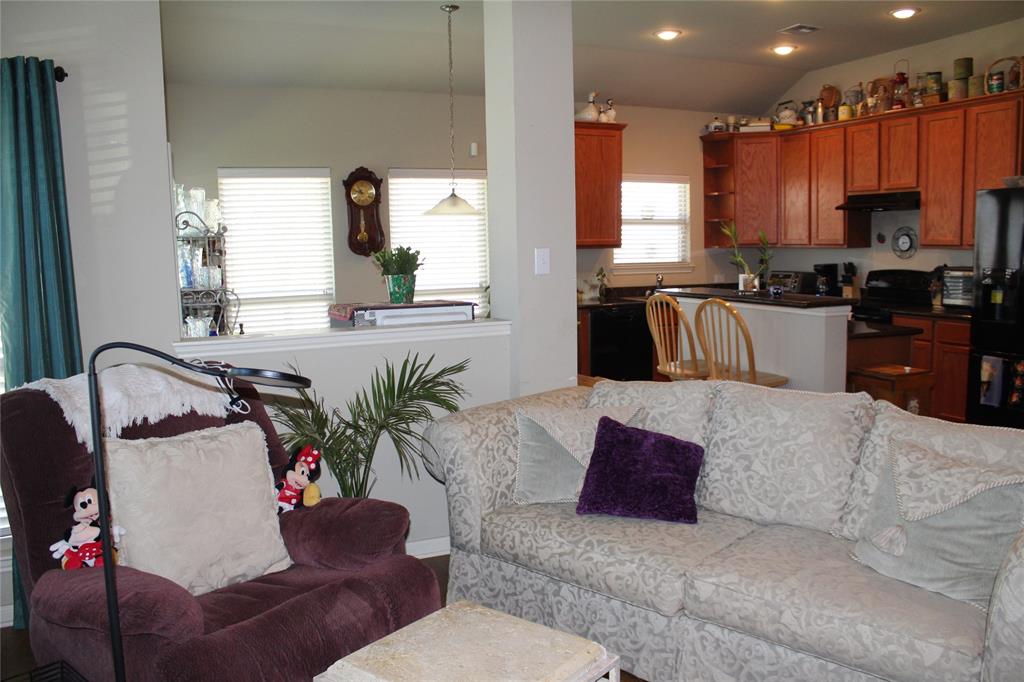 10717 Fallbrook Road Waco, TX 76708 - Photo 4 of 33 a living room with furniture kitchen view and a large window