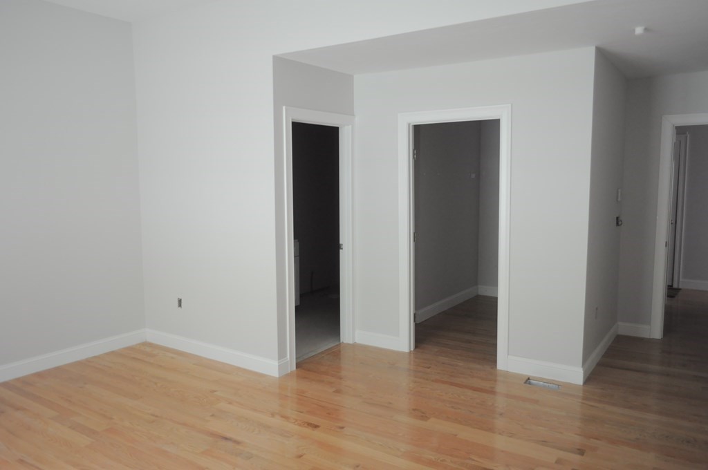 12 B Trail Ridge Way, Unit 12B Harvard, MA 01451 - Photo 18 of 20 a view of an empty room with wooden floor