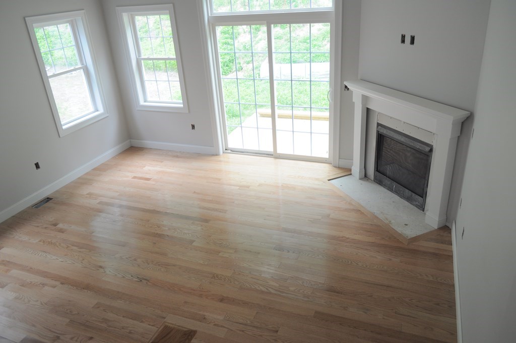 12 B Trail Ridge Way, Unit 12B Harvard, MA 01451 - Photo 5 of 20 a view of empty room with window and fireplace