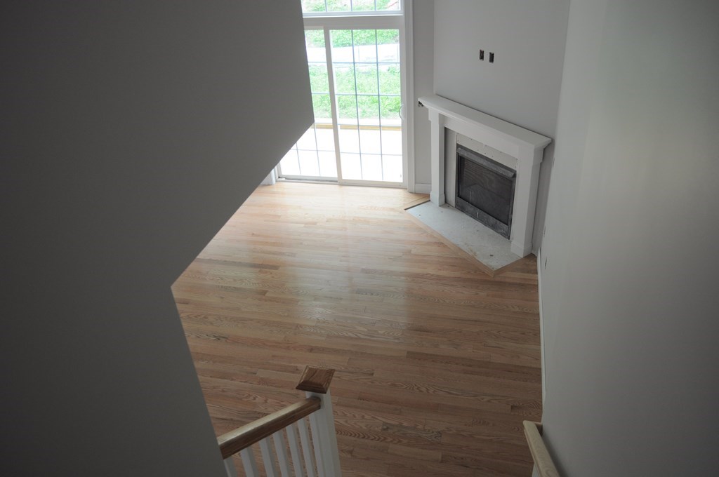 12 B Trail Ridge Way, Unit 12B Harvard, MA 01451 - Photo 6 of 20 a view of hallway with washer and dryer