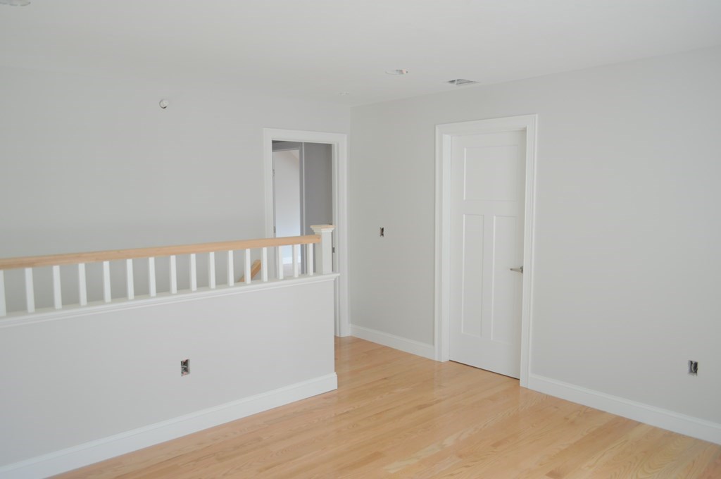 12 B Trail Ridge Way, Unit 12B Harvard, MA 01451 - Photo 8 of 20 a view of a bedroom with wooden floor