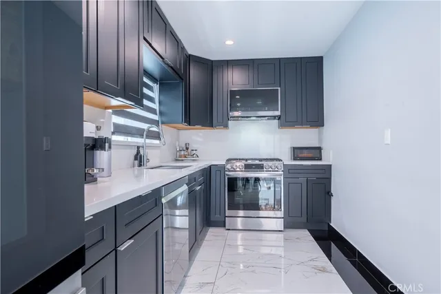 a kitchen with a refrigerator and a sink