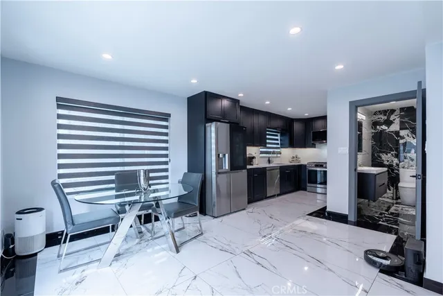 a kitchen with a sink cabinets and window