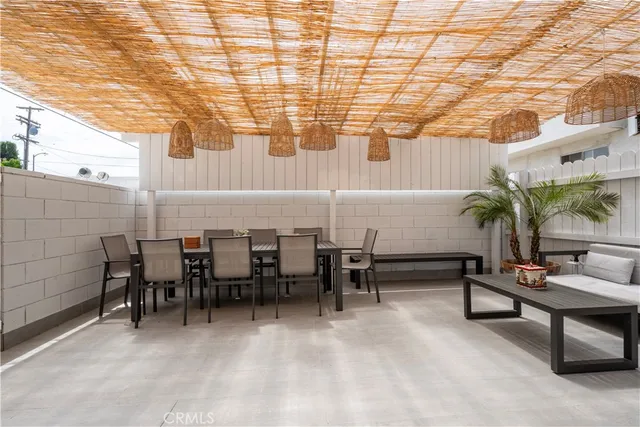 a view of a patio with table and chairs