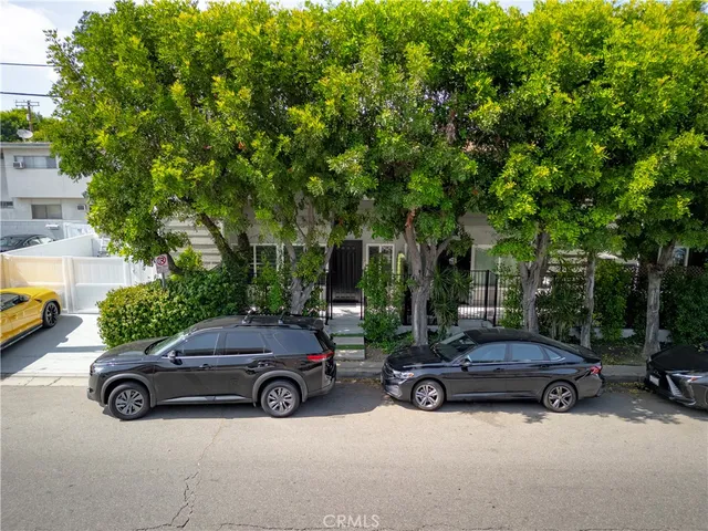 a view of a car parked in front of a house