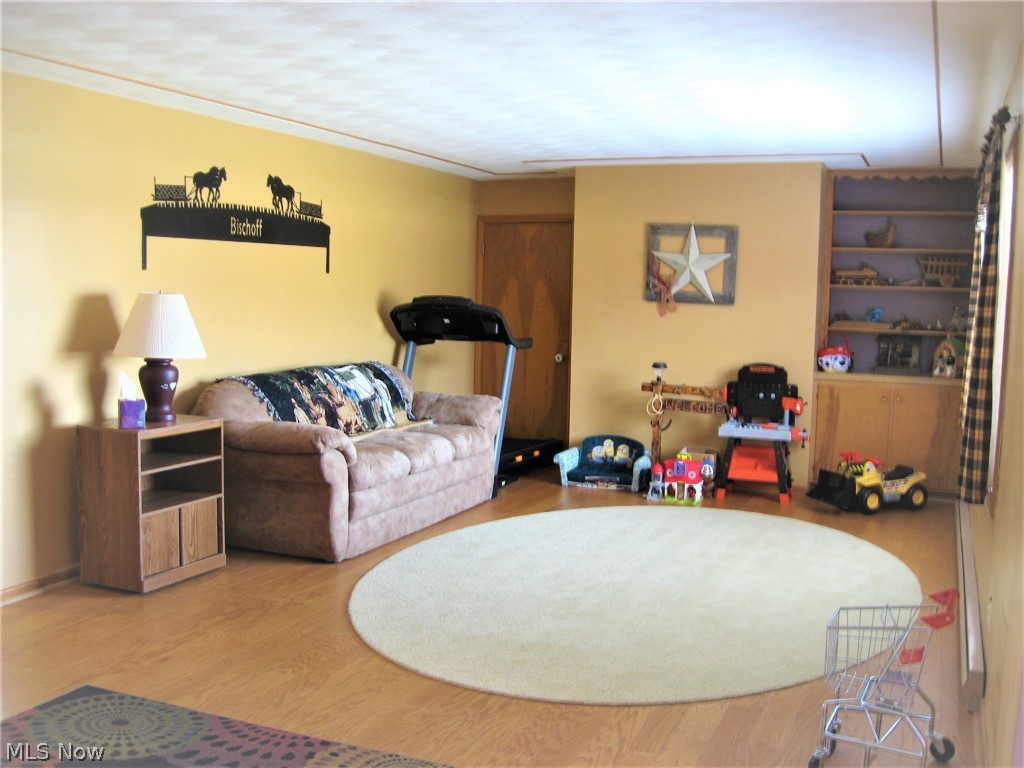 9108 Spencer Road Homerville, OH 44235 - Photo 3 of 14 Enter the spacious living room with hardwood floors.