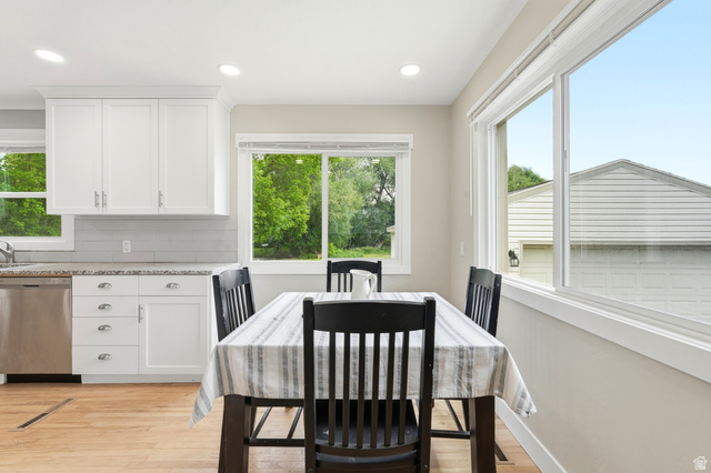778 East 200 North Logan, UT 84321 - Photo 23 of 43 Bright dining area featuring wood-finish flooring, recessed lighting, and large windows