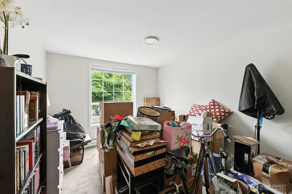 a bedroom with furniture and a window