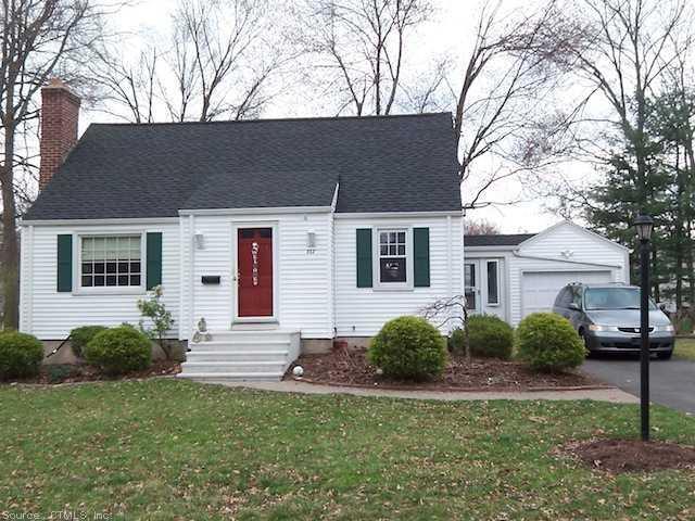 312 Brimfield Road Wethersfield, CT 06109 - Photo 1 of 1 a backyard of a house with potted plants and large tree