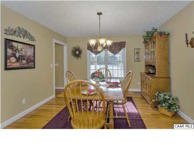 686 Valley View Road Ruckersville, VA 22968 - Photo 11 of 33 a living room with furniture and a chandelier