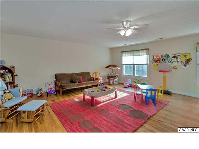 686 Valley View Road Ruckersville, VA 22968 - Photo 27 of 33 a living room with furniture and a dining table with kitchen view