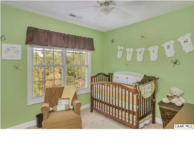 686 Valley View Road Ruckersville, VA 22968 - Photo 8 of 33 a bedroom with a bed and a window