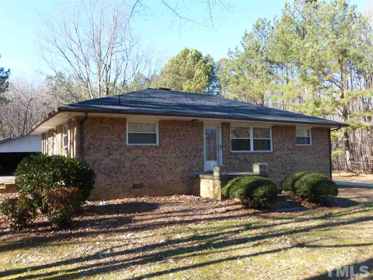 2314 Carpenter Pond Road Raleigh, NC 27613 - Photo 1 of 12 a front view of a house with garden