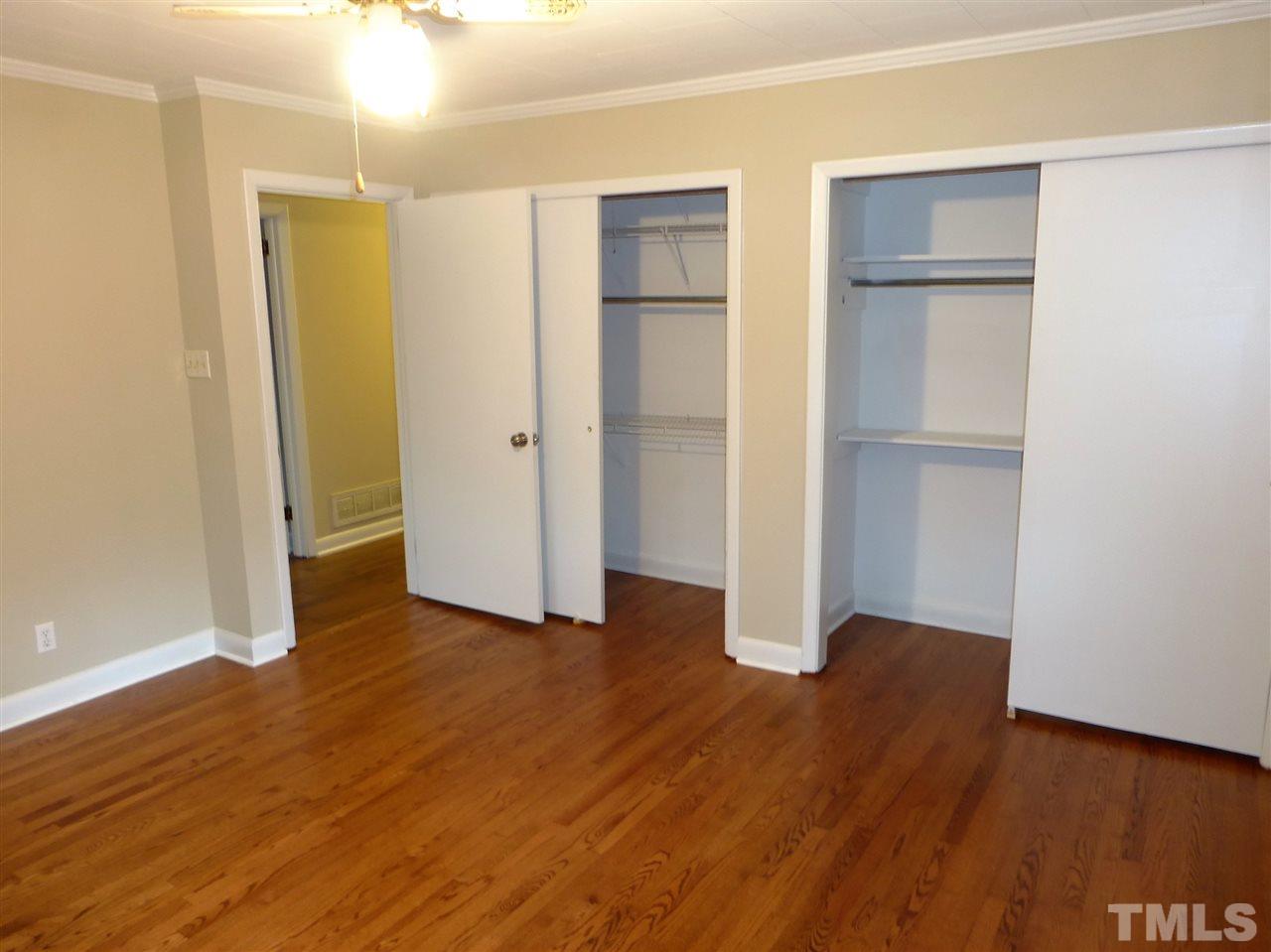 2314 Carpenter Pond Road Raleigh, NC 27613 - Photo 11 of 12 a view of an empty room with wooden floor