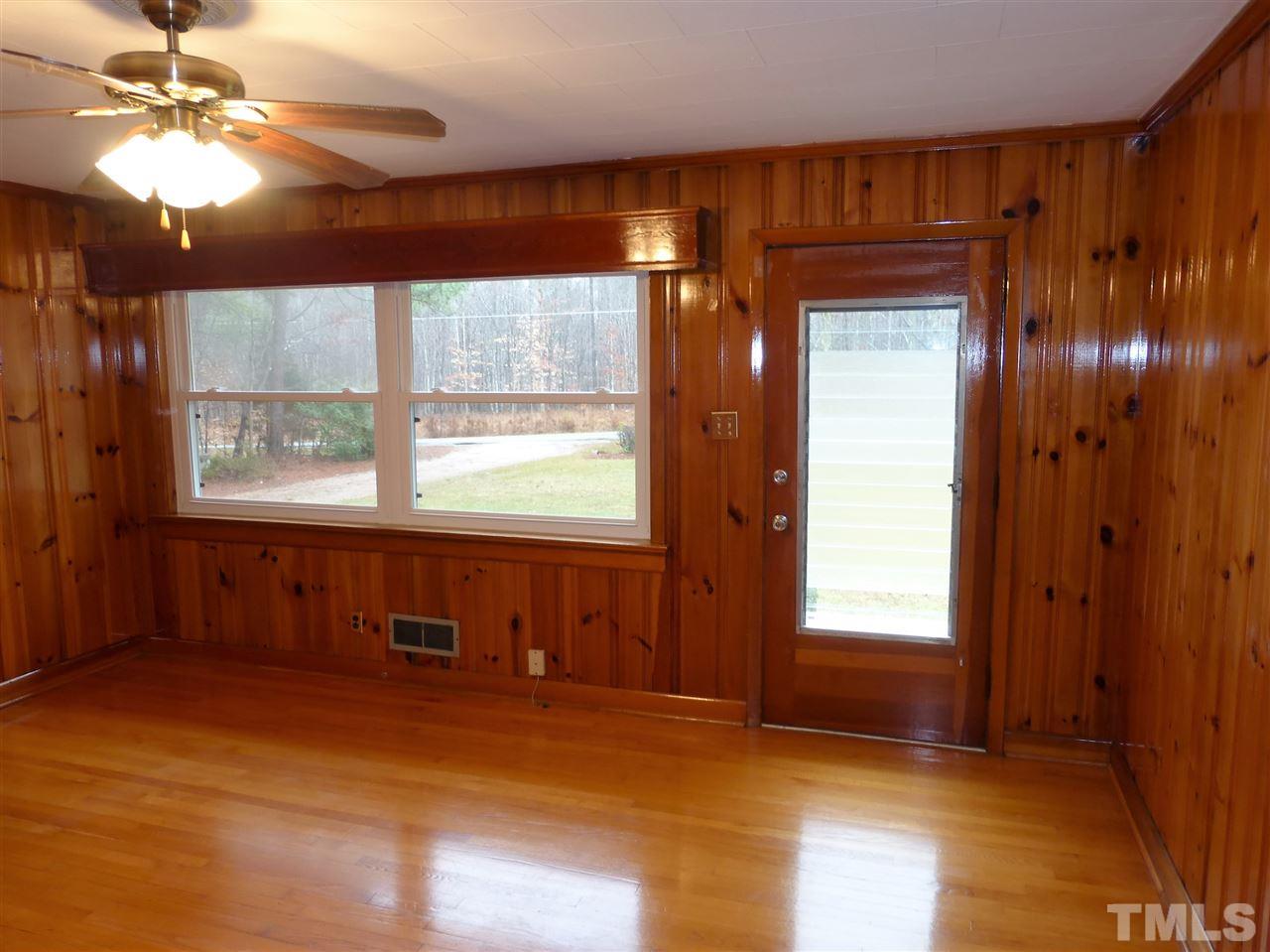 2314 Carpenter Pond Road Raleigh, NC 27613 - Photo 8 of 12 a view of empty room with window and a ceiling fan