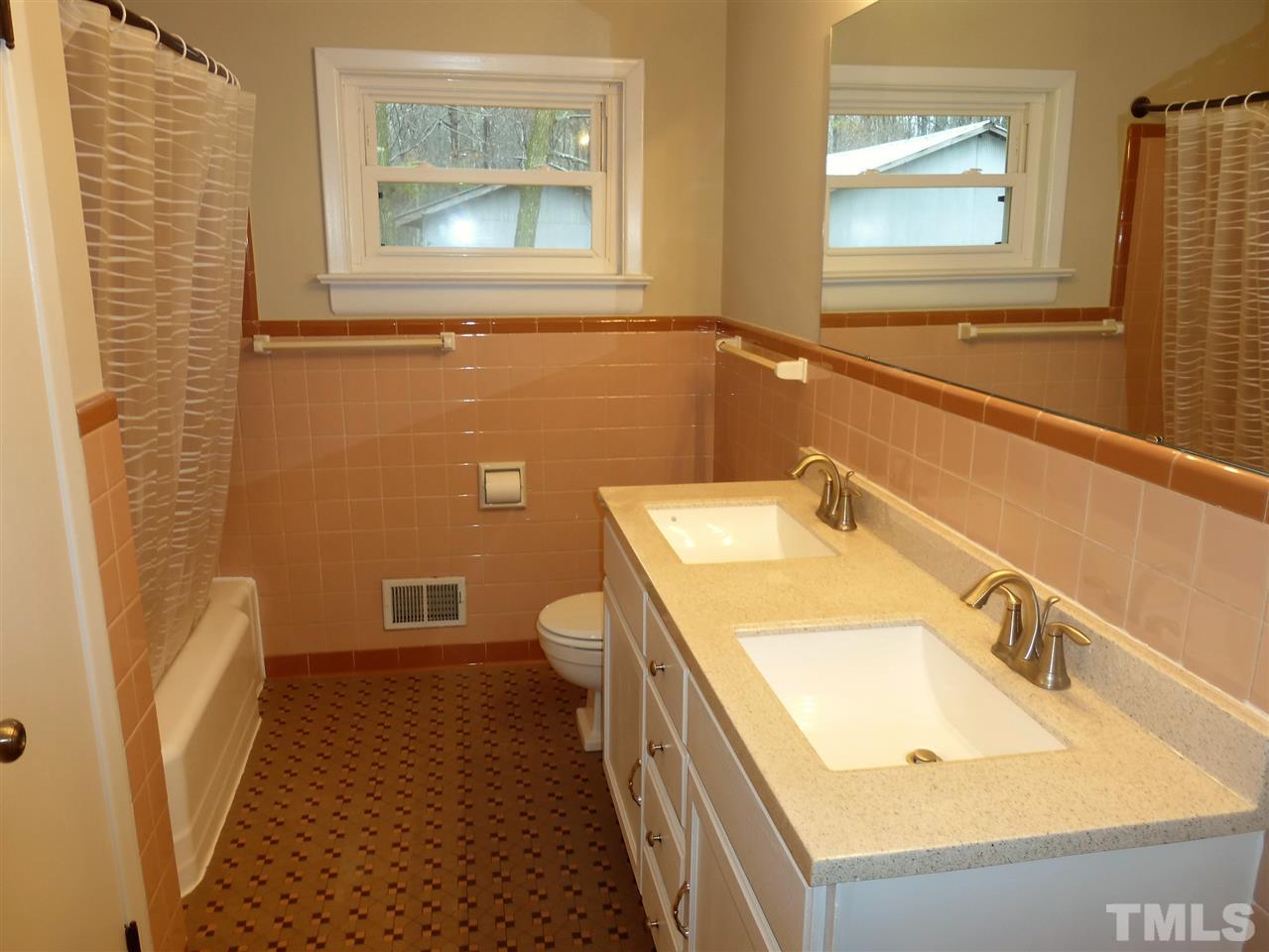 2314 Carpenter Pond Road Raleigh, NC 27613 - Photo 9 of 12 a bathroom with a sink and a mirror