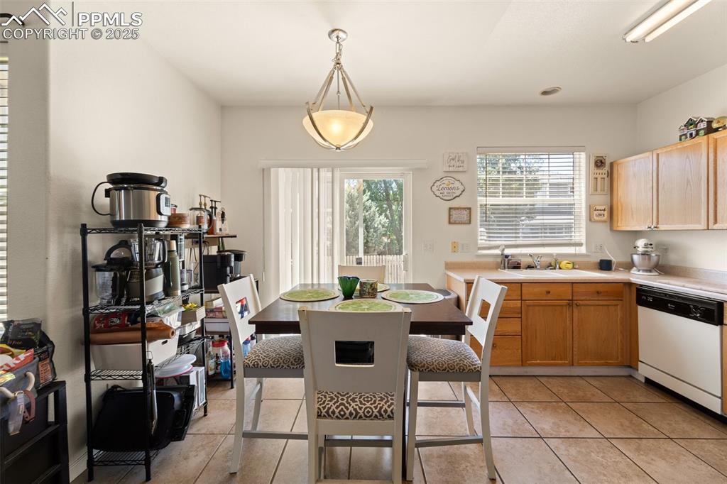 6963 Maram Way Fountain, CO 80817 - Photo 10 of 22 a view of a dining room with furniture window and outside view