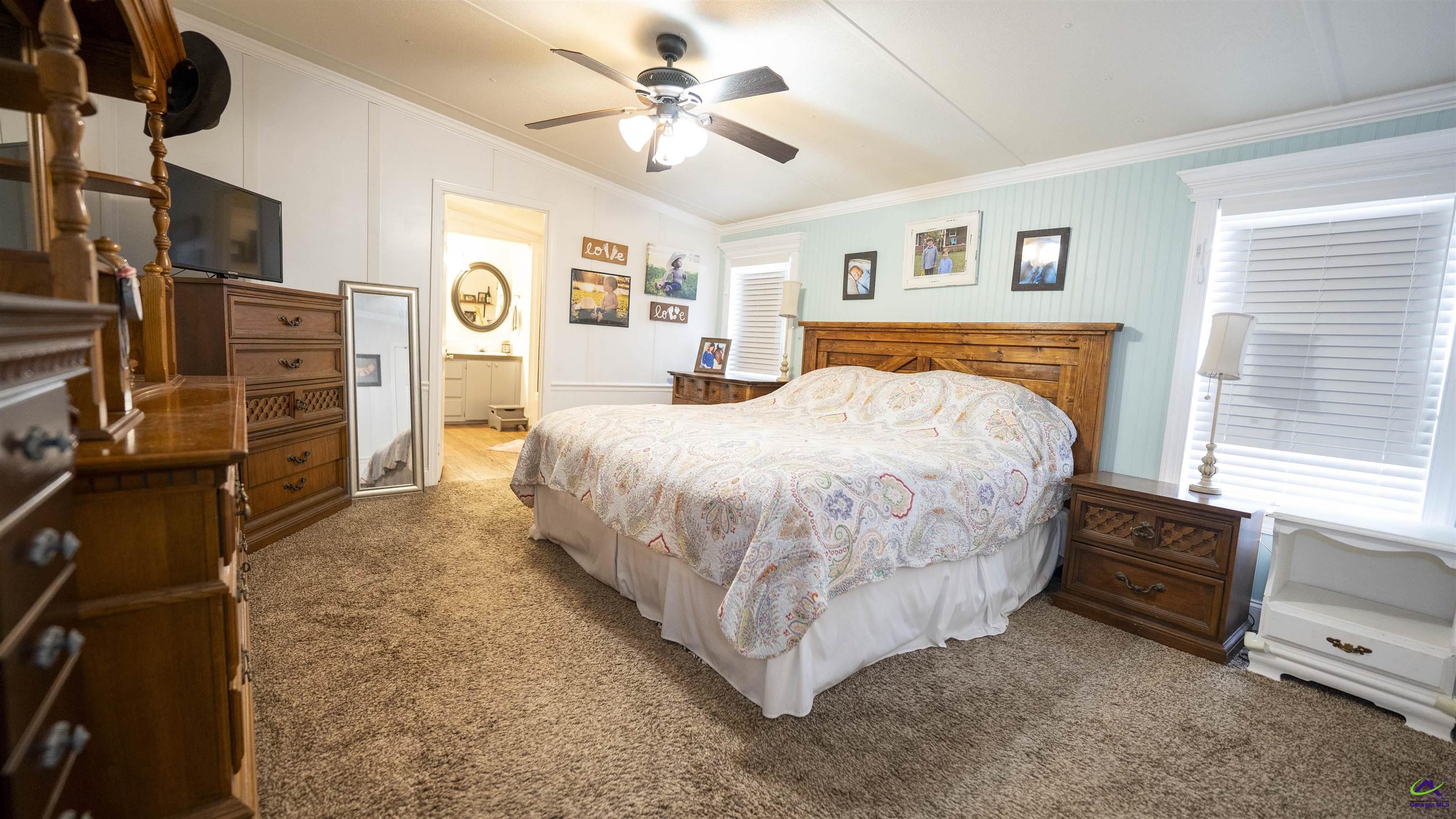 500 Old Milledgeville Road Cochran, GA 31014 - Photo 36 of 48 a bedroom with a bed dresser and window