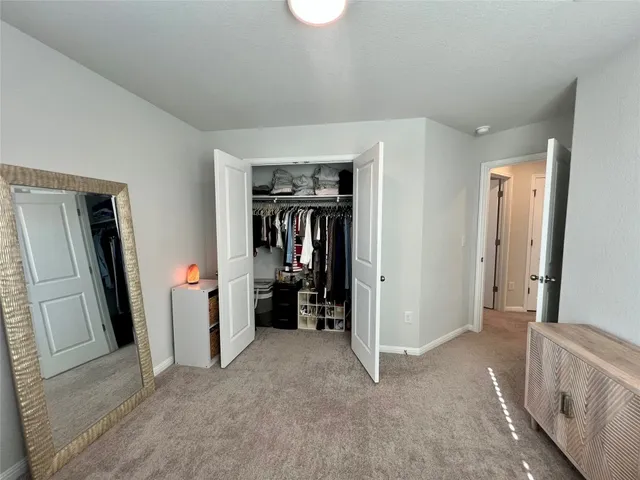 a view of room with furniture and refrigerator