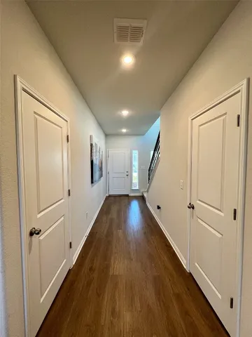 a view of gallery with wooden floor