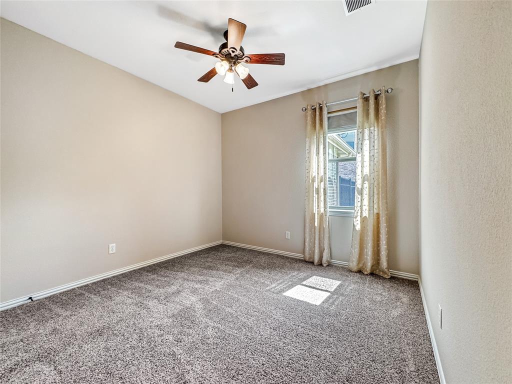 401 Varnum Way Fairview, TX 75069 - Photo 22 of 33 an empty room with a empty space and a ceiling fan