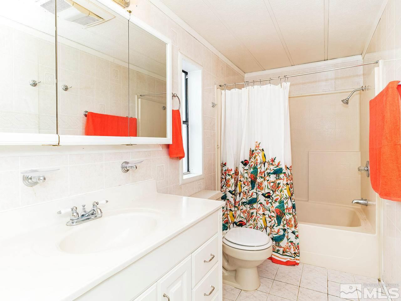 3935 Brant Street Reno, NV 89508 - Photo 12 of 15 a bathroom with a sink toilet and shower