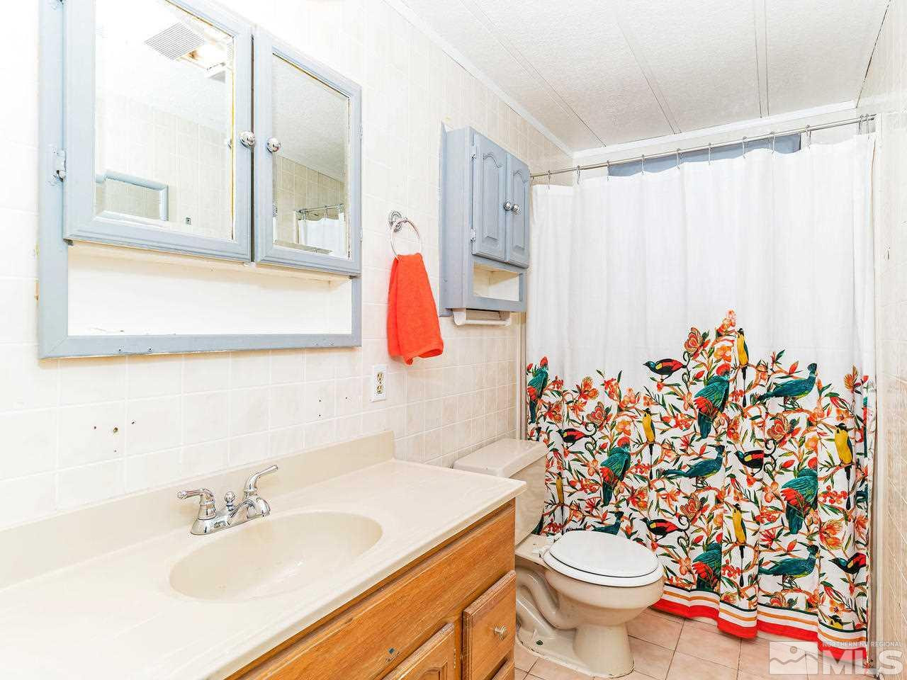 3935 Brant Street Reno, NV 89508 - Photo 15 of 15 a bathroom with a sink toilet and shower