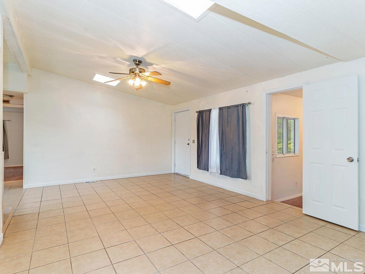 3935 Brant Street Reno, NV 89508 - Photo 4 of 15 a view of an empty room with chandelier fan