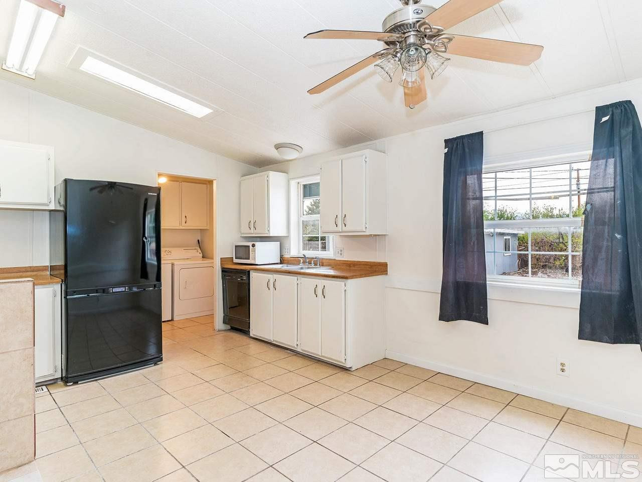 3935 Brant Street Reno, NV 89508 - Photo 5 of 15 a kitchen with a refrigerator a sink and dishwasher