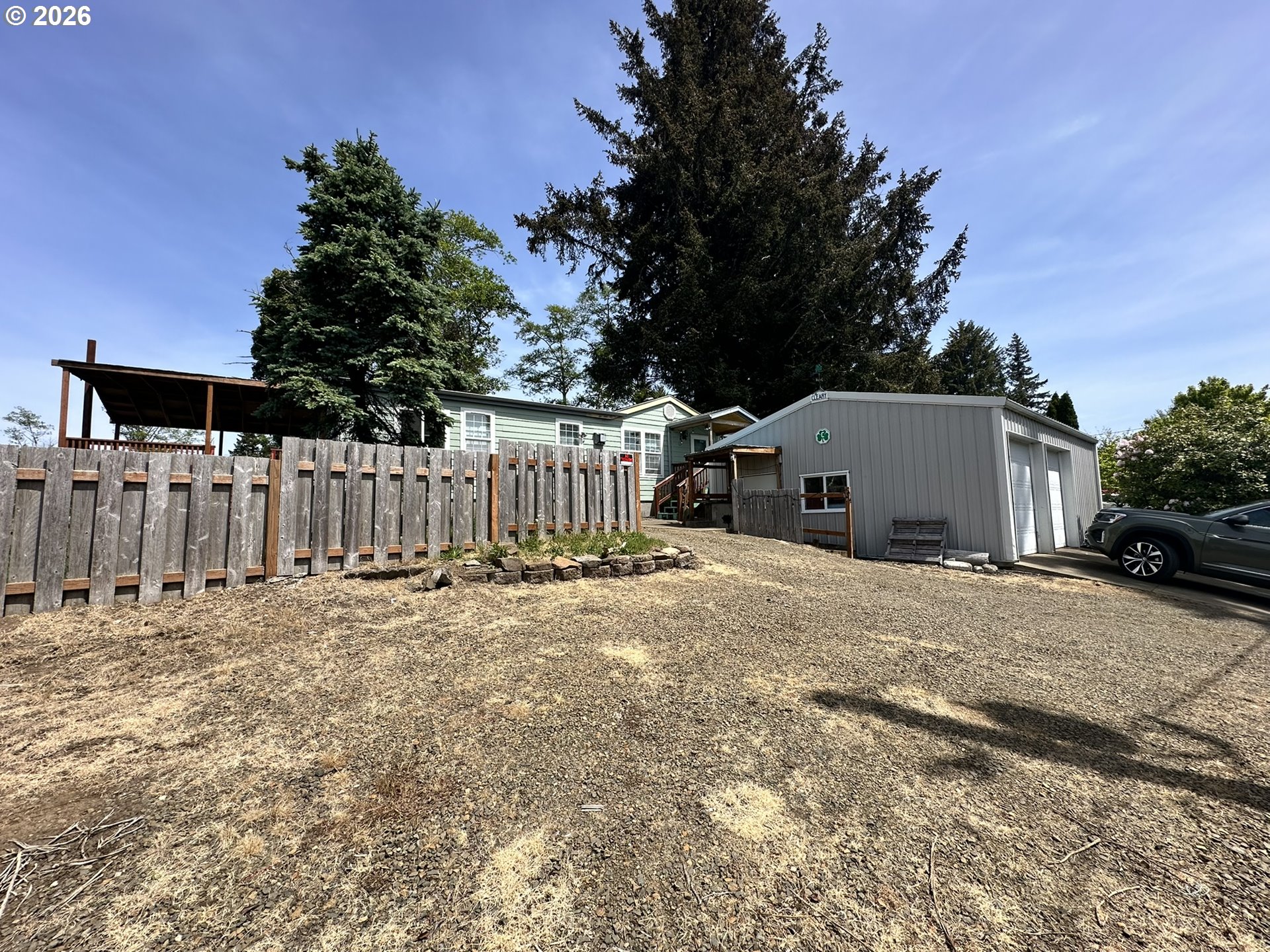 4821 Northeast 50th Street Neotsu, OR 97364 - Photo 19 of 19 a view of a house with backyard and trees