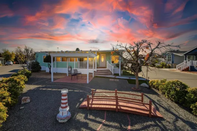 a view of a patio with swimming pool table and chairs