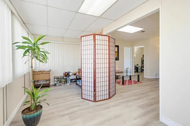 a en suite bathroom with a granite countertop sink and a mirror