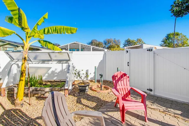a view of a patio with swimming pool table and chairs