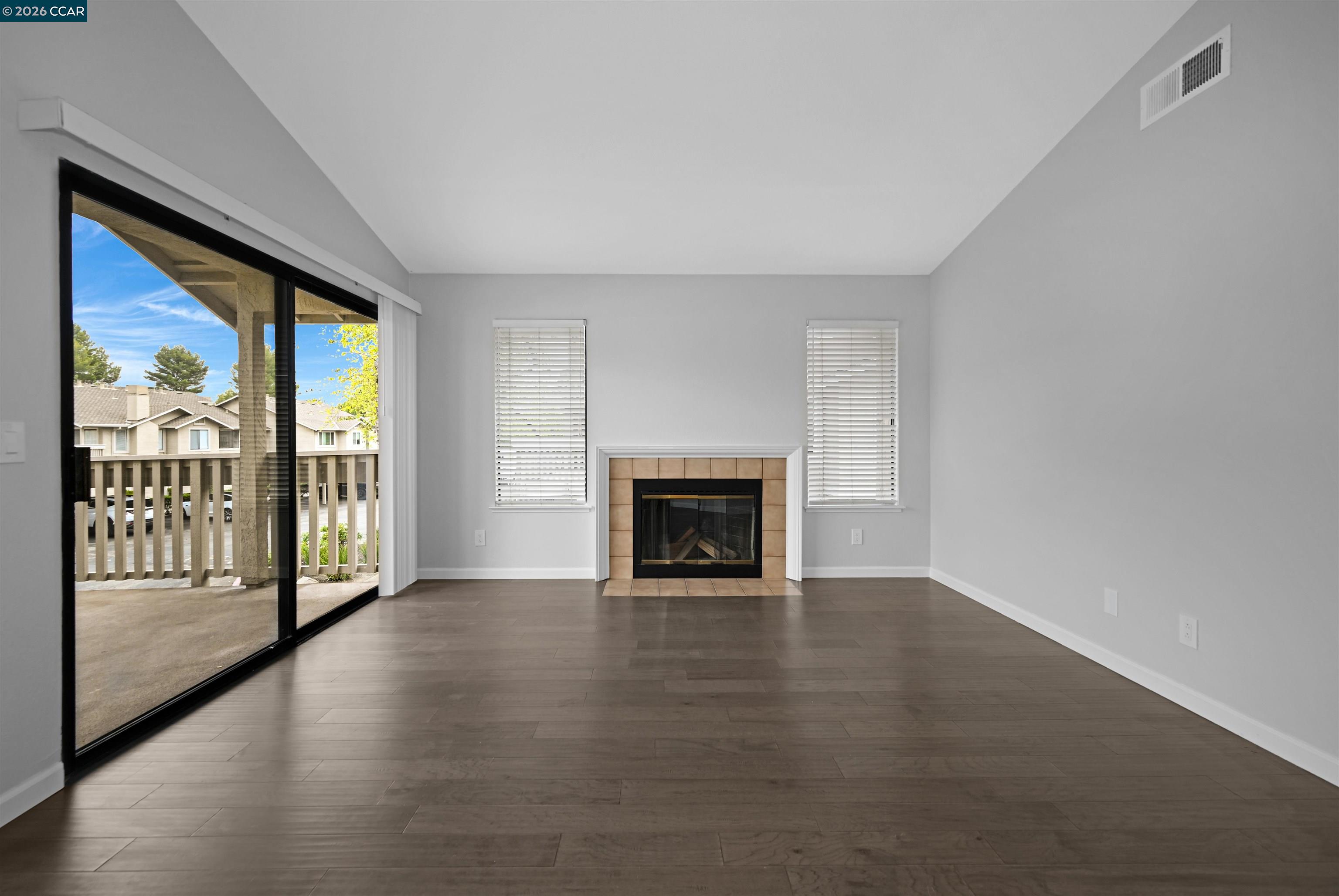 3659 Crow Canyon Road San Ramon, CA 94582 - Photo 8 of 26 a view of an empty room with a fireplace and a window