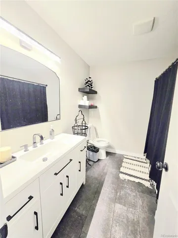 a bathroom with a sink a mirror and shower