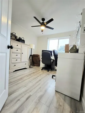 a view of a room with wooden floor