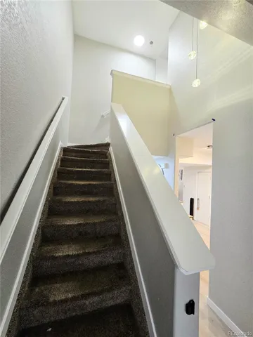 a view of a backyard with sitting area