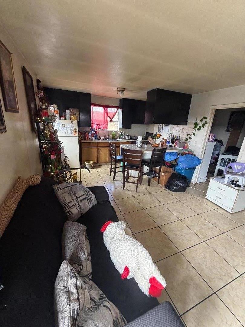 615 Terrace Street Salinas, CA 93905 - Photo 5 of 7 a living room with furniture and a flat screen tv
