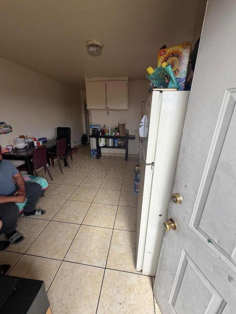 615 Terrace Street Salinas, CA 93905 - Photo 7 of 7 a living room with furniture and a chandelier