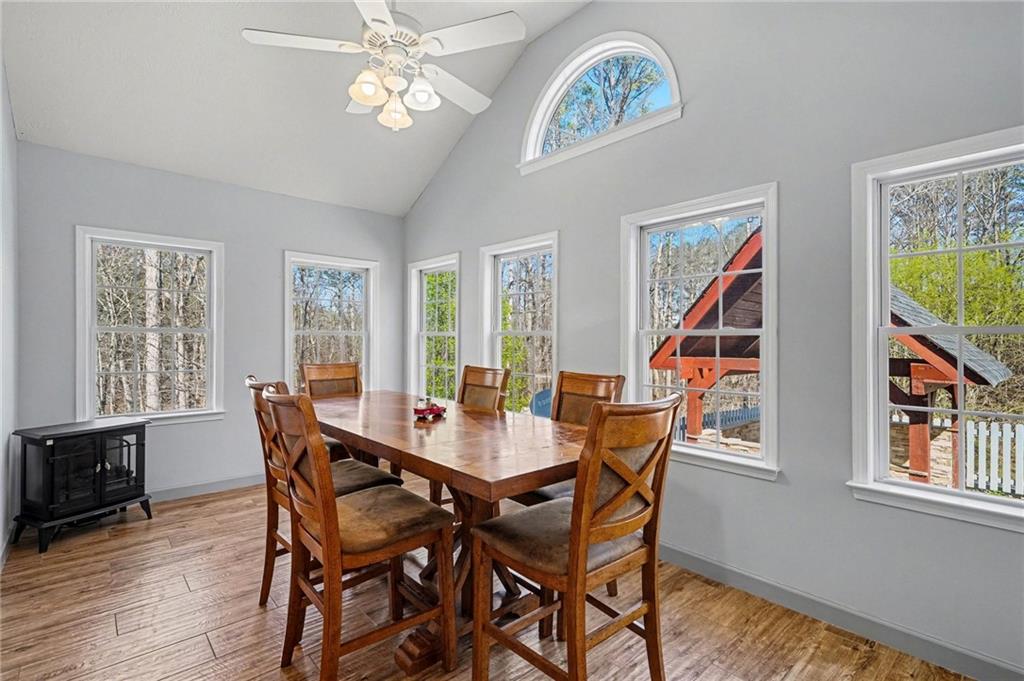 526 Antioch Church Road Talking Rock, GA 30175 - Photo 12 of 38 a view of a dining room with furniture a chandelier and wooden floor