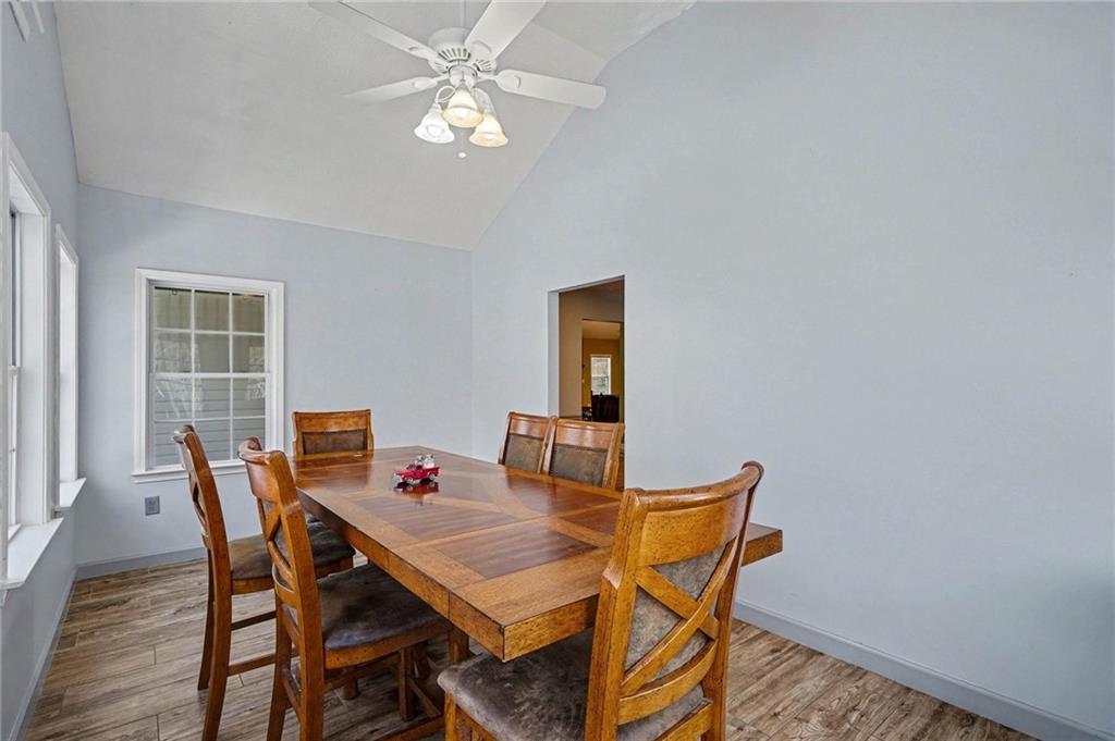 526 Antioch Church Road Talking Rock, GA 30175 - Photo 13 of 38 a view of a dining room with furniture and wooden floor